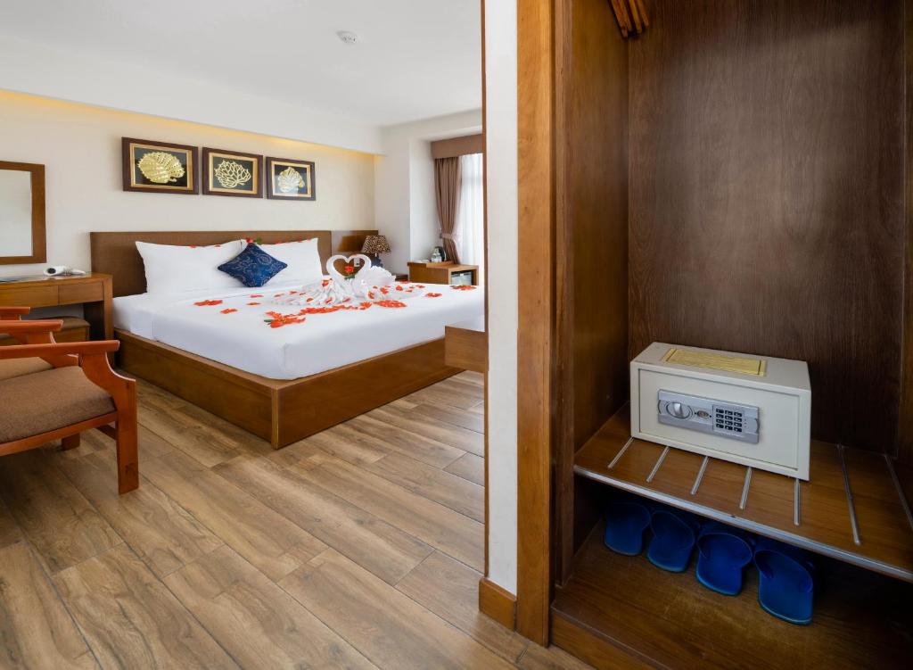 Postel nebo postele na pokoji v ubytování Saphia Hotel Nha Trang