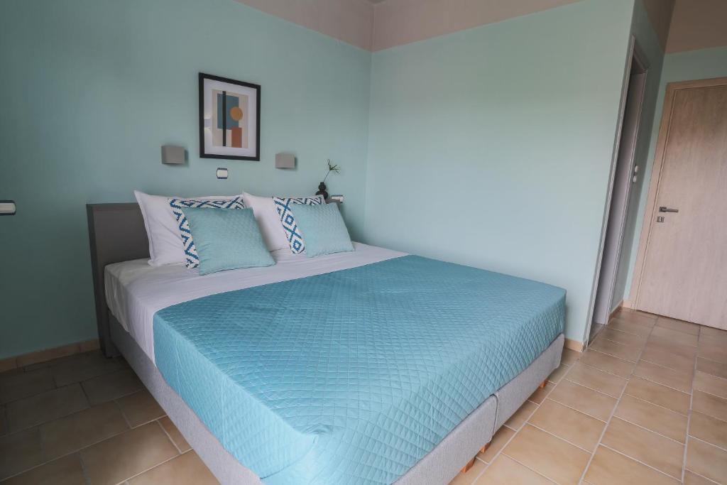 Voodi või voodid majutusasutuse Joya Ofrynio Stylish Suites toas