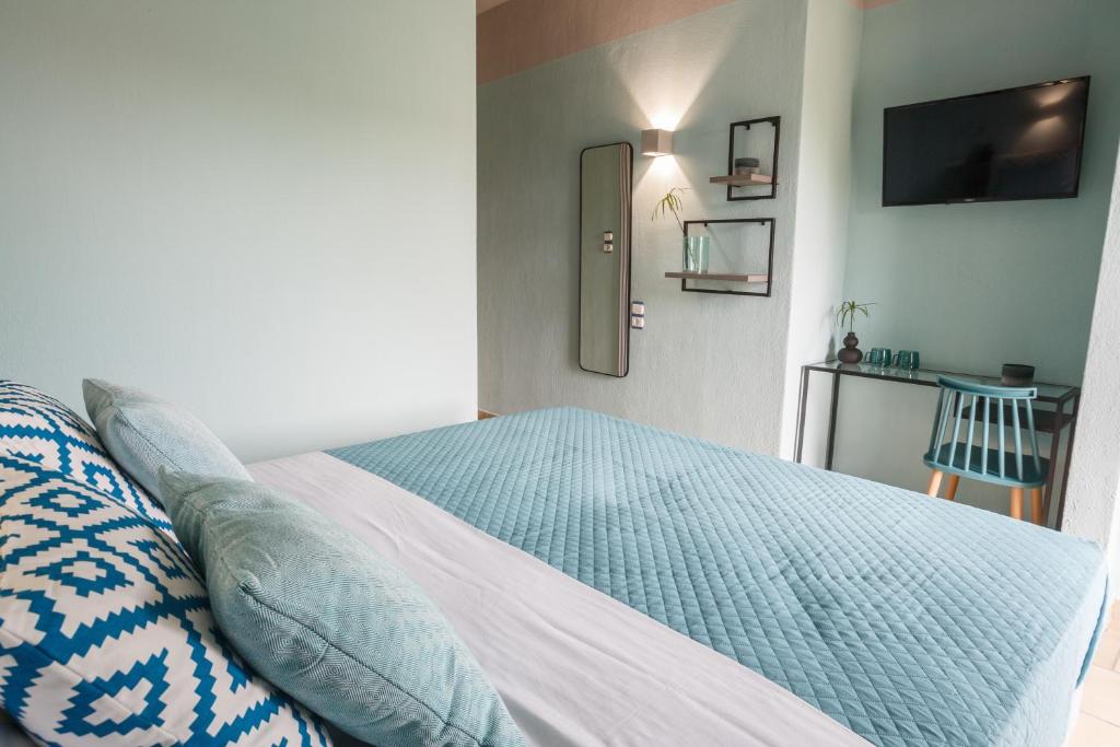 Voodi või voodid majutusasutuse Joya Ofrynio Stylish Suites toas