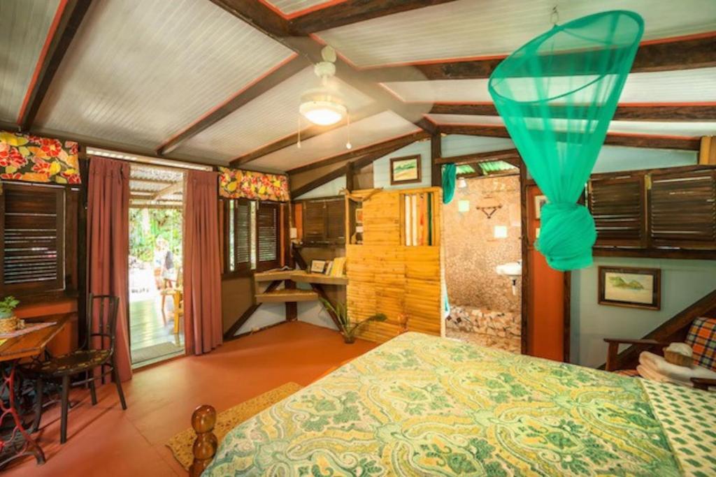 Postel nebo postele na pokoji v ubytování Cocoa Cottage