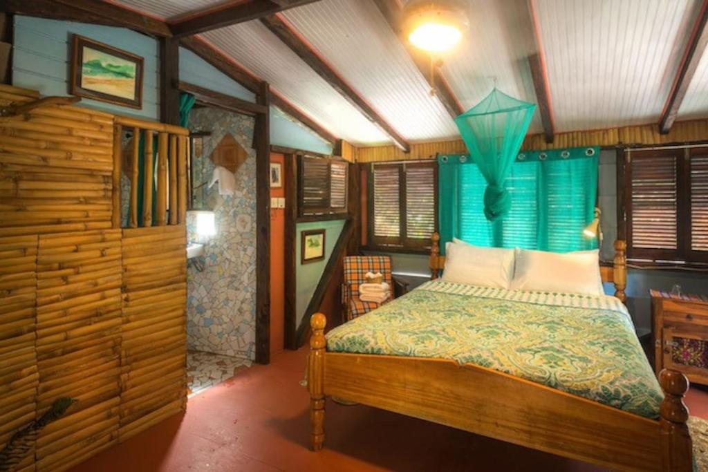 Postel nebo postele na pokoji v ubytování Cocoa Cottage