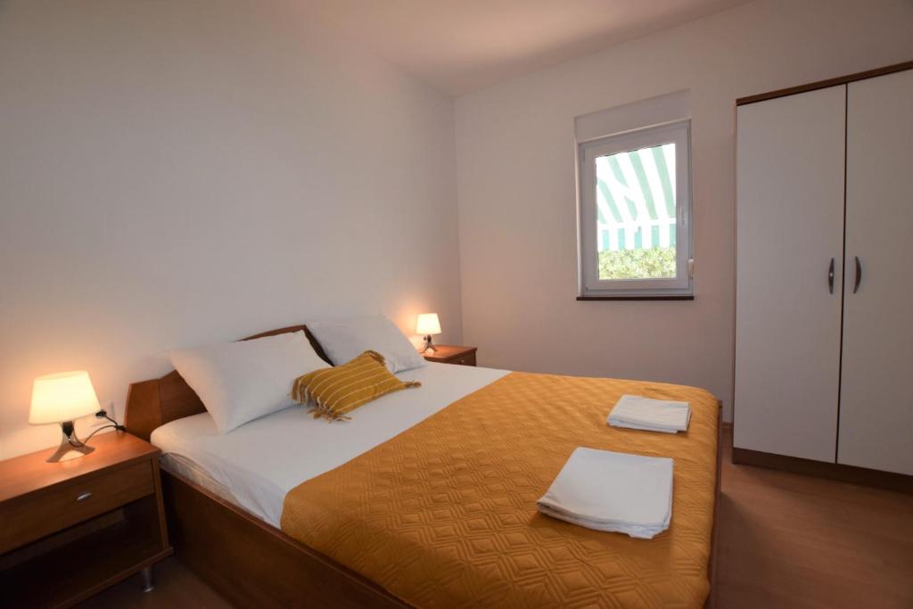 Łóżko lub łóżka w pokoju w obiekcie Holiday Home Movica