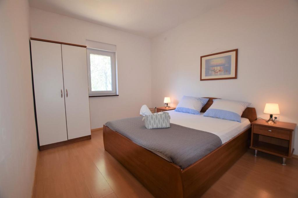 Łóżko lub łóżka w pokoju w obiekcie Holiday Home Movica