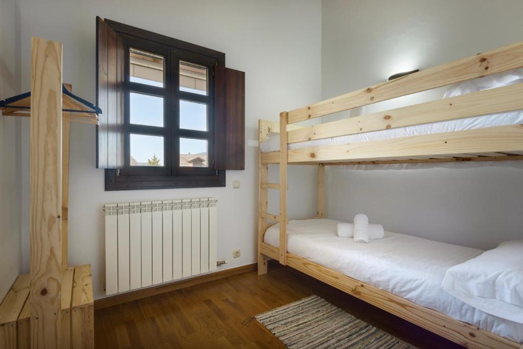 Postel nebo postele na pokoji v ubytování SERENDIPITY BADAGUAS