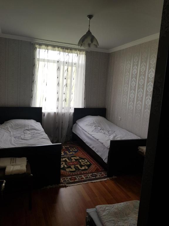 Postel nebo postele na pokoji v ubytování Guest House AREVIK