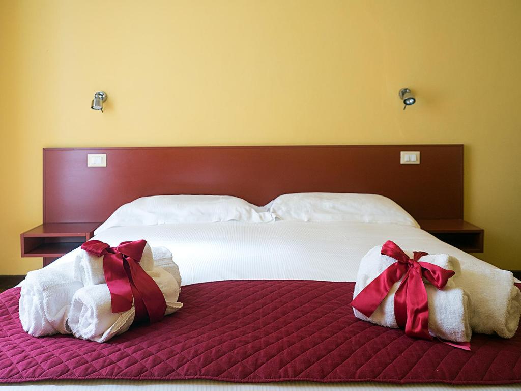 Postel nebo postele na pokoji v ubytování Residenza Viani Guest House