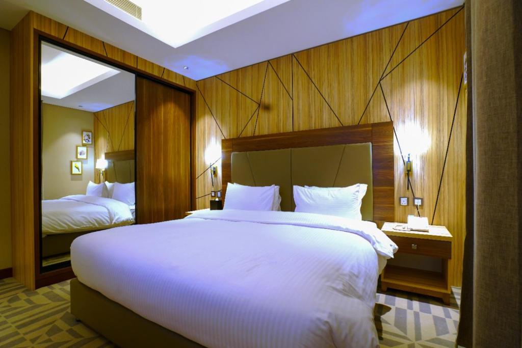 Letto o letti in una camera di Al Aseel Hotel