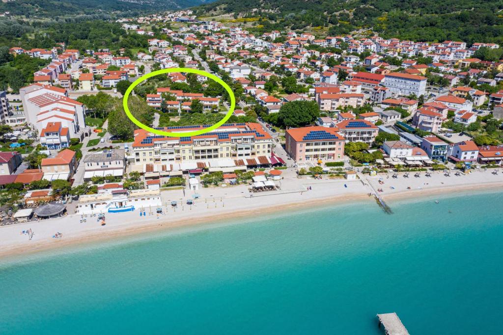an aerial view of a beach with a yellow circle at Villas Corinthia in Baška