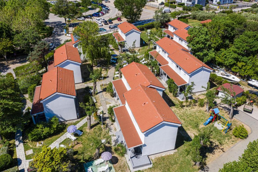 an overhead view of a row of houses with orange roofs at Villas Corinthia in Baška