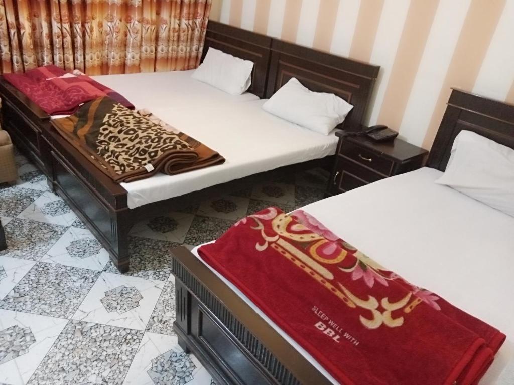 Postel nebo postele na pokoji v ubytování HOTEL DE GRAND