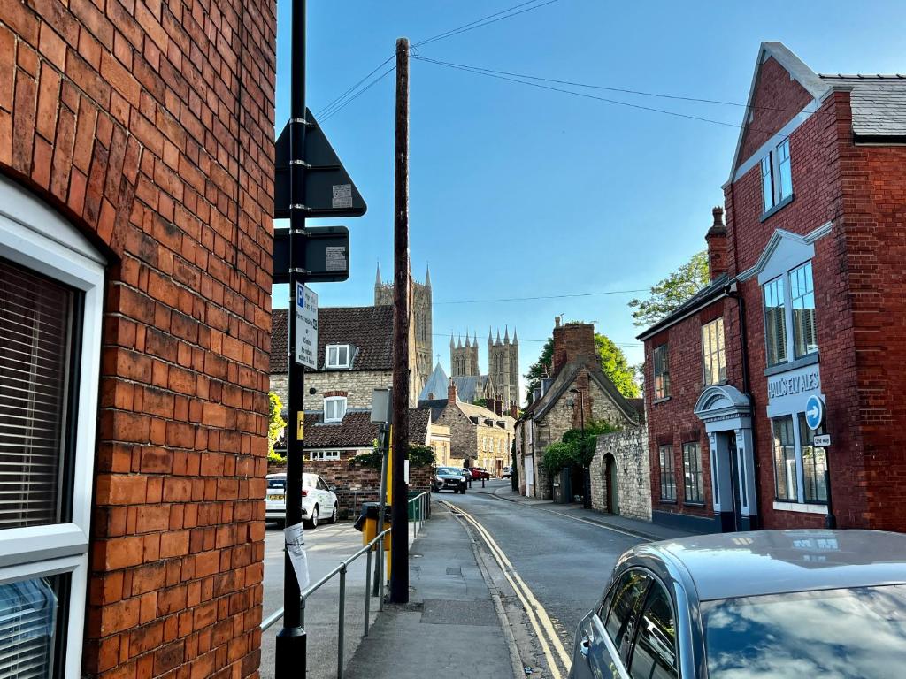 a street in an old town with a building at 10 Langworthgate in Lincoln