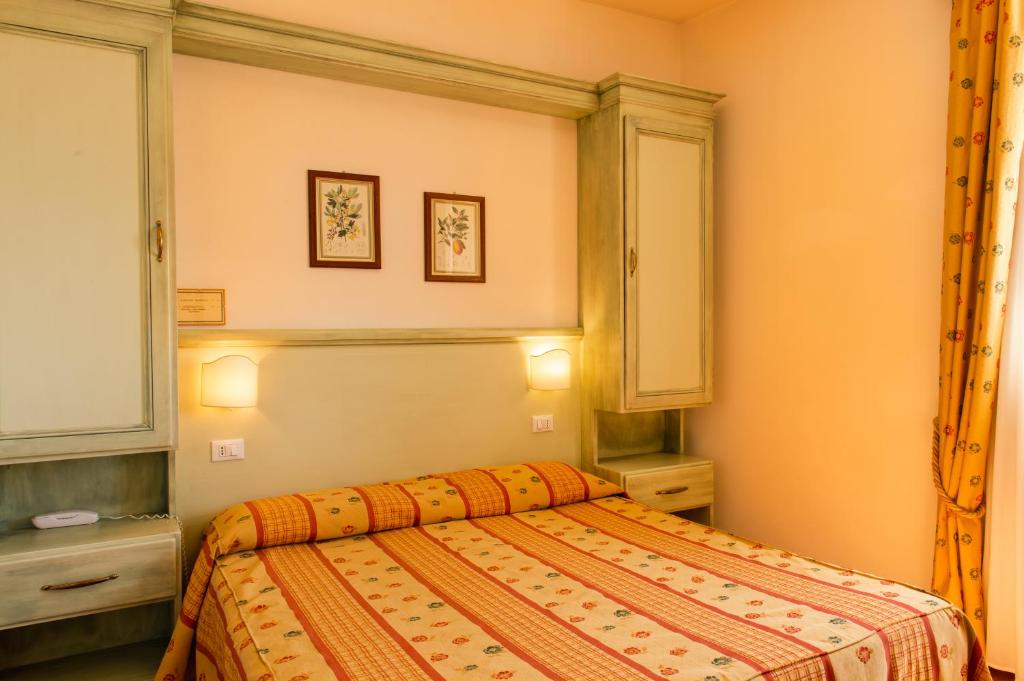 Postel nebo postele na pokoji v ubytování Hotel Minerva