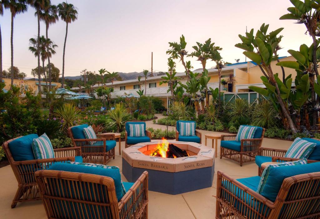 a group of chairs and a fire pit on a patio at Pavilion Hotel in Avalon