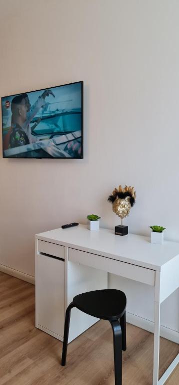 Televízia a/alebo spoločenská miestnosť v ubytovaní TokiTakai Collection