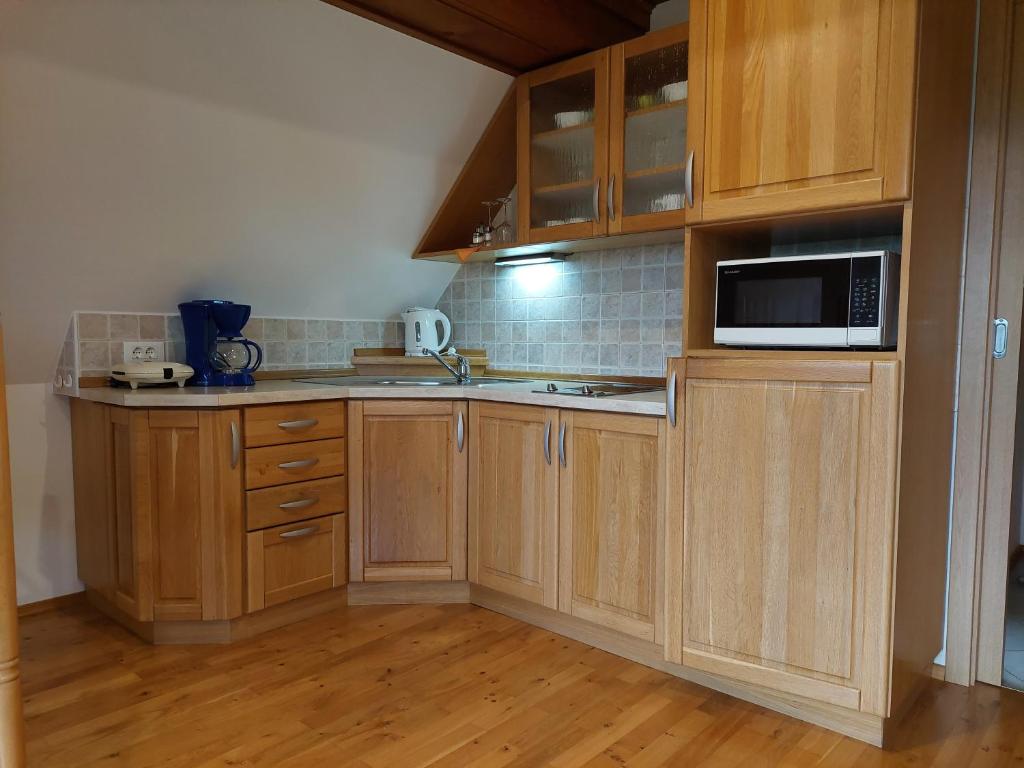 Kuchyň nebo kuchyňský kout v ubytování Apartmaji Vesna