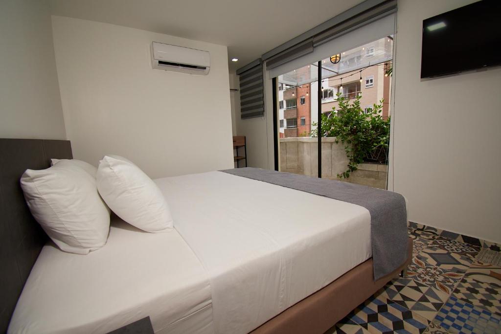 Postel nebo postele na pokoji v ubytování Brana by Bernalo Hotels
