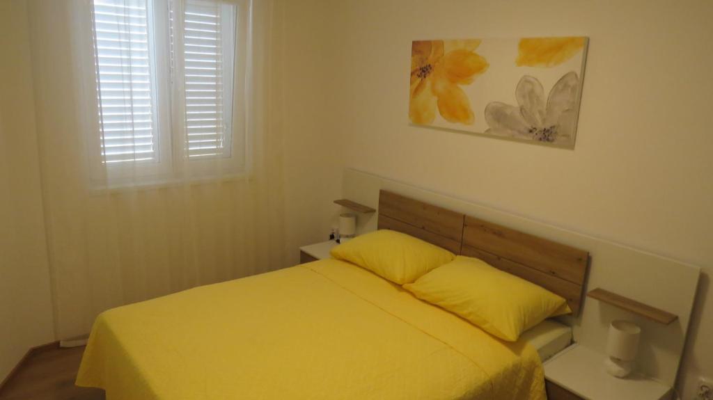 Postel nebo postele na pokoji v ubytování Apartments LUCIA