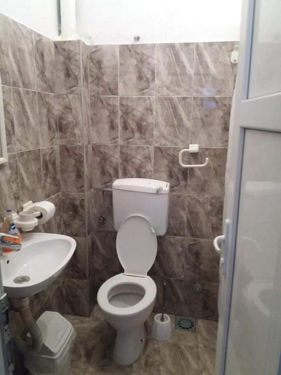 a small bathroom with a toilet and a sink at Apartment’s Maric - Zelenika,Herceg Novi in Zelenika