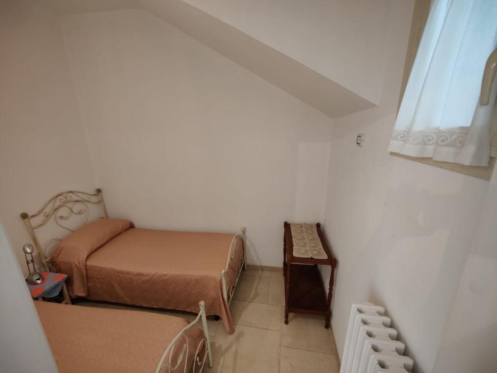 A bed or beds in a room at La Nuova Casetta