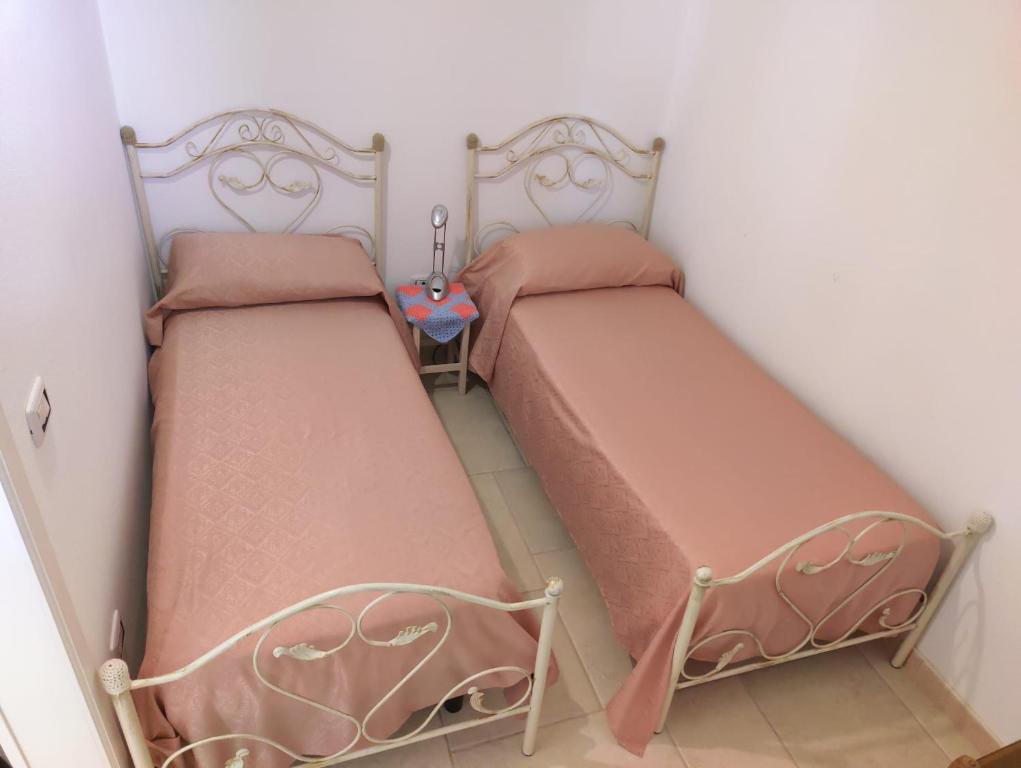 A bed or beds in a room at La Nuova Casetta