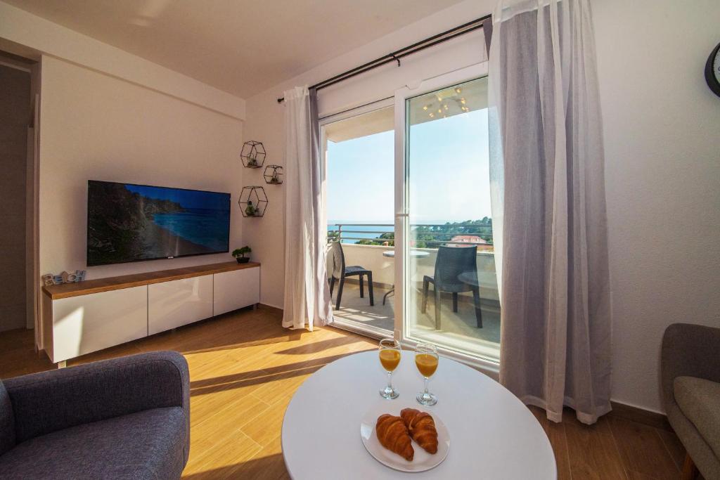 Televízia a/alebo spoločenská miestnosť v ubytovaní Apartment MARE