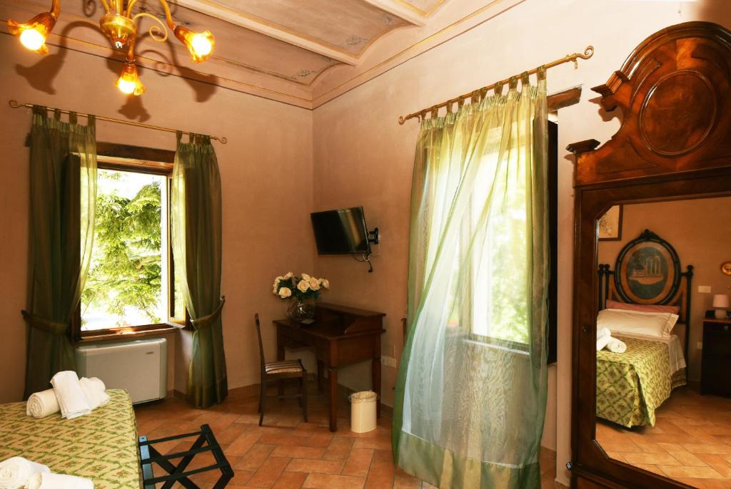 Łóżko lub łóżka w pokoju w obiekcie AGRITURISMO Villino Bellavista
