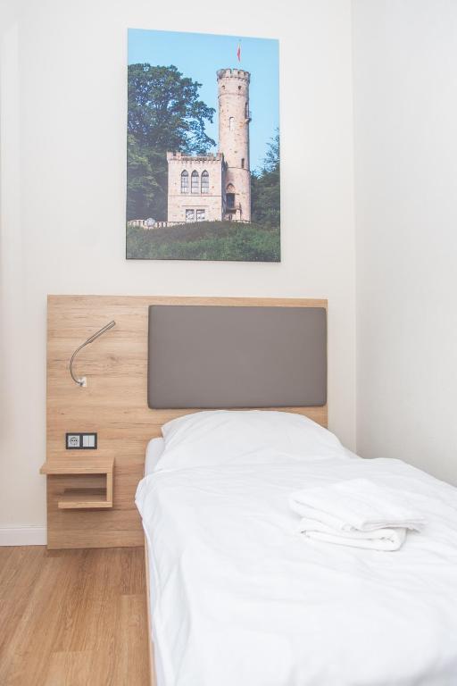 Postel nebo postele na pokoji v ubytování Hotel Fulda