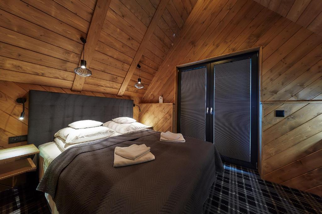 Postel nebo postele na pokoji v ubytování Domki 1010 m
