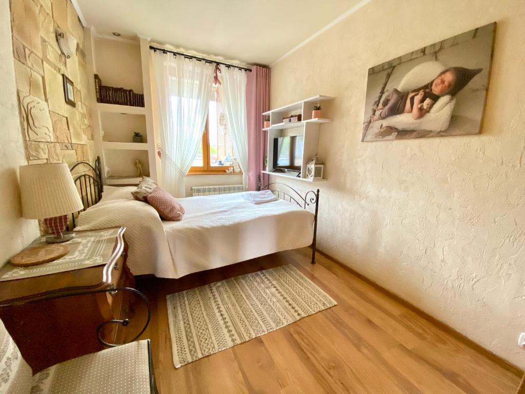 Posteľ alebo postele v izbe v ubytovaní Apartament przy Krupówkach - Laszka