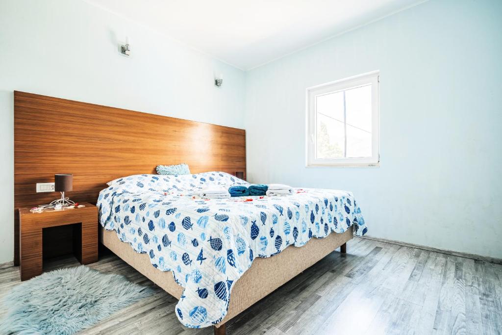 Postel nebo postele na pokoji v ubytování Green Hill Apartment