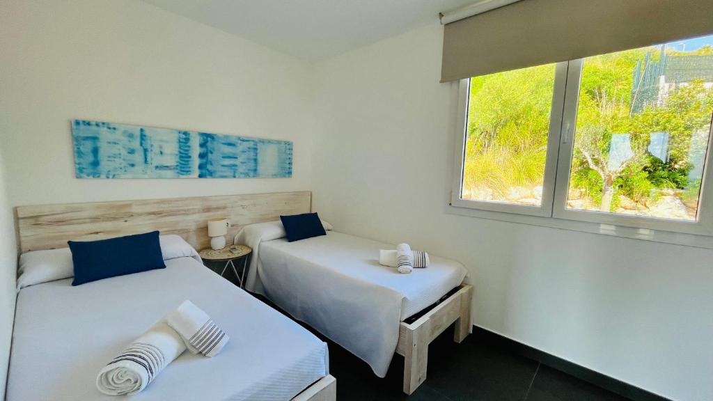 Postel nebo postele na pokoji v ubytování Villas Tin Coves Noves