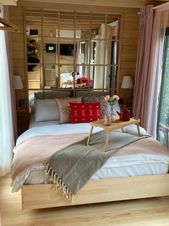 Postel nebo postele na pokoji v ubytování Vagona Tiny House