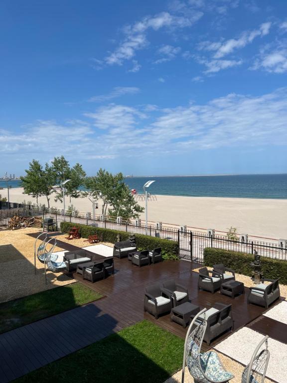 a view of the beach from the balcony of a resort at MIMOZA - Apartaments Panoramic Sea View in Eforie Nord