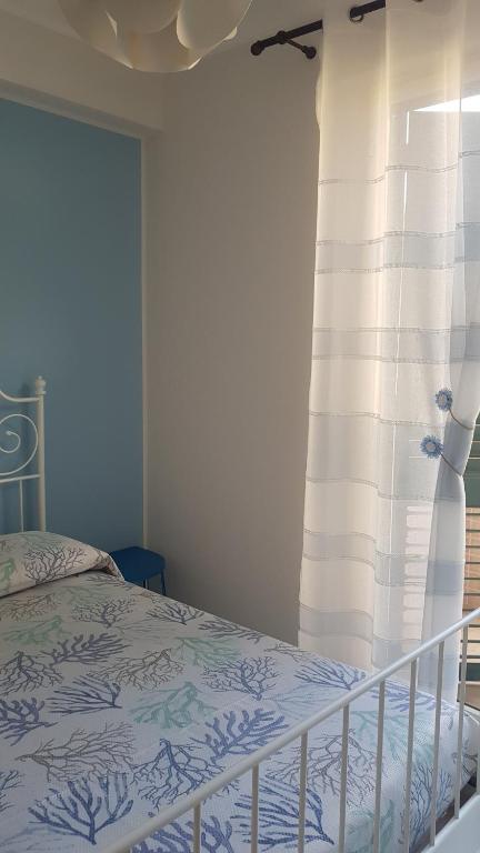 Postel nebo postele na pokoji v ubytování Casa Azzurra