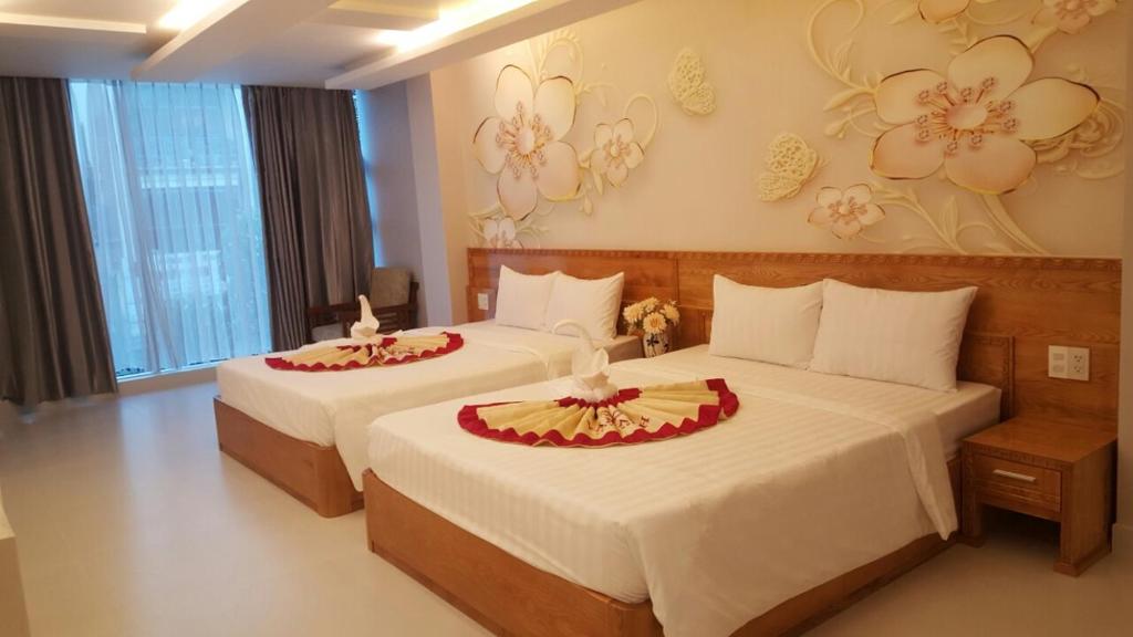 A bed or beds in a room at Vân Anh Luxury