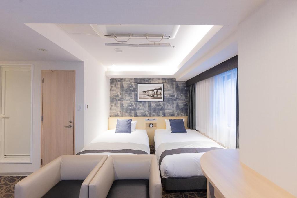 Posteľ alebo postele v izbe v ubytovaní Hotel Actel Nagoya Nishiki