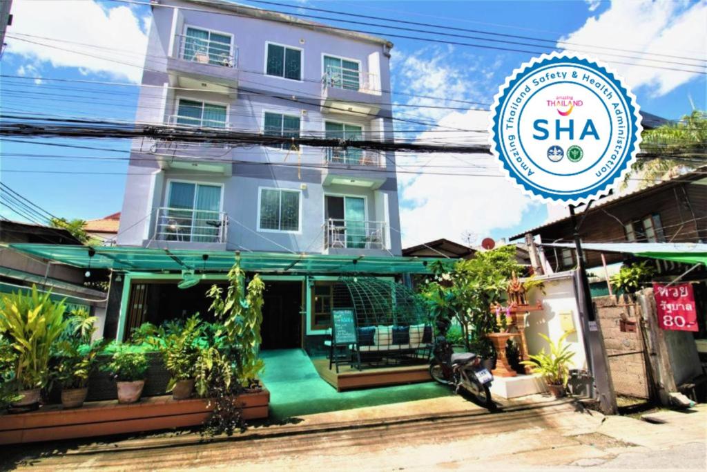 a building with a sign in front of it at Chinda Boutique Hotel - SHA Certified in Chiang Mai