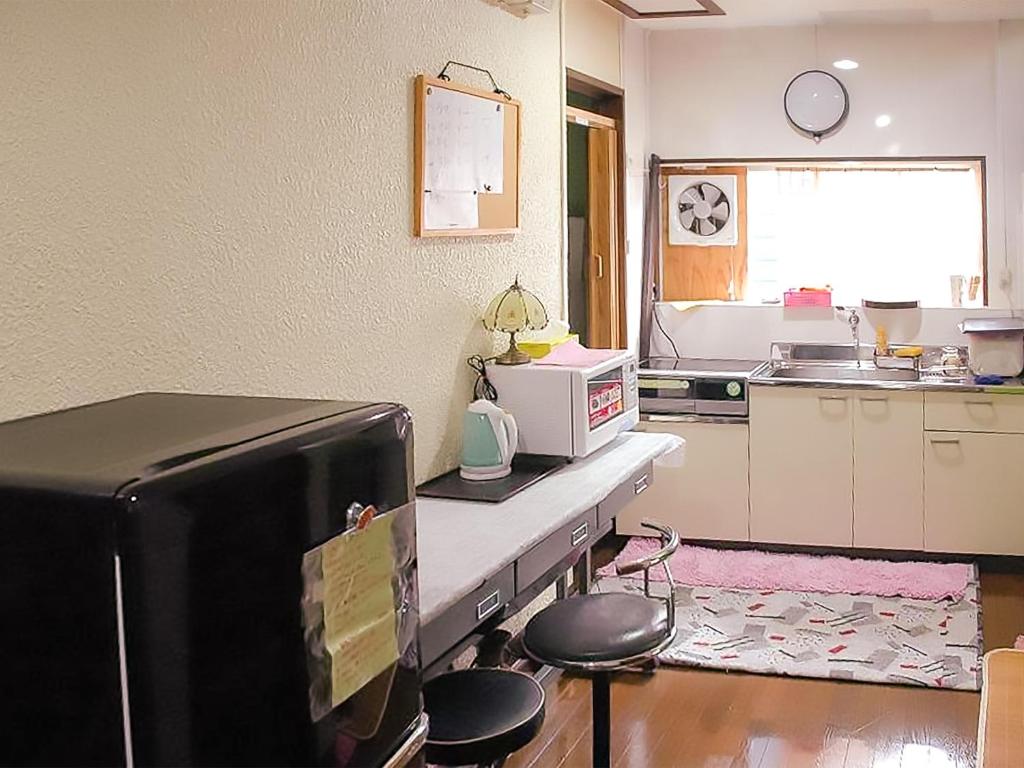 Kuchyň nebo kuchyňský kout v ubytování Oyama Guesthouse Kyoto