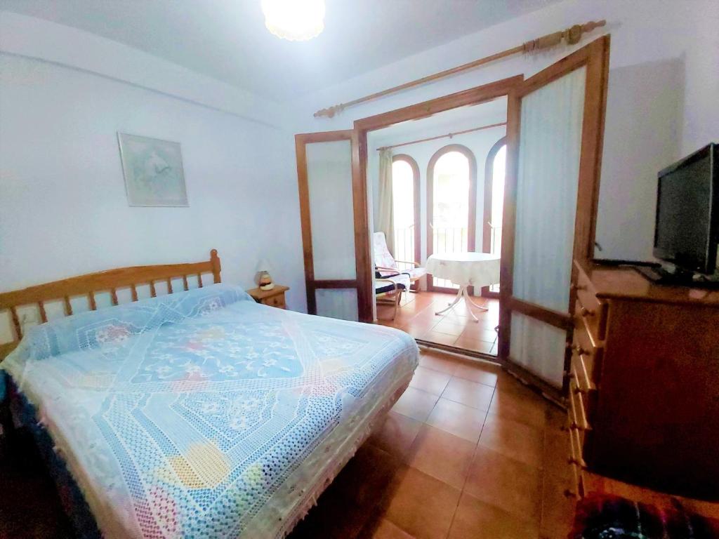 A bed or beds in a room at Central apartment Calpe
