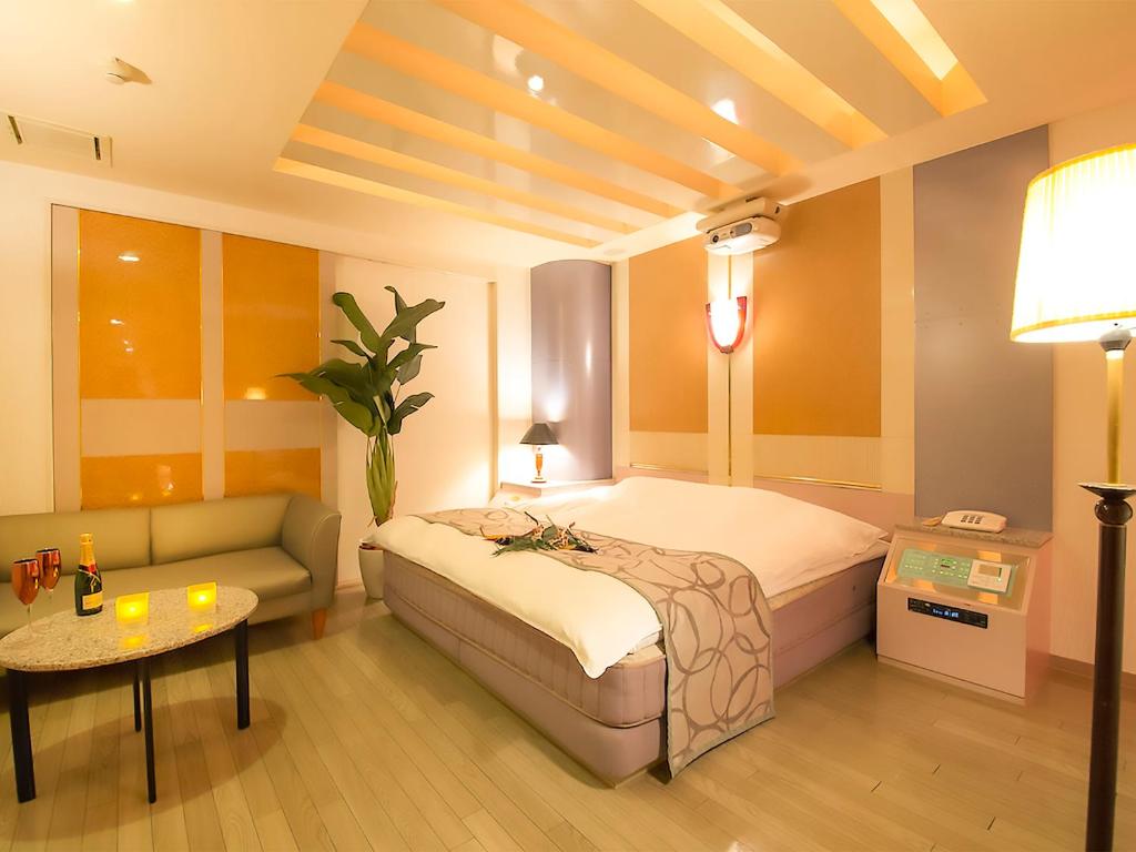 Postel nebo postele na pokoji v ubytování Hotel Rocco (Adult Only)