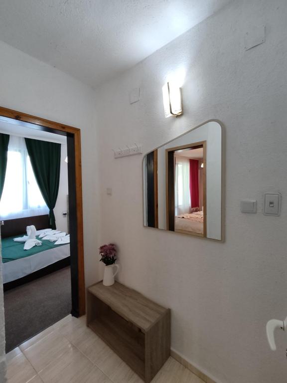 Postel nebo postele na pokoji v ubytování Rali Apartments