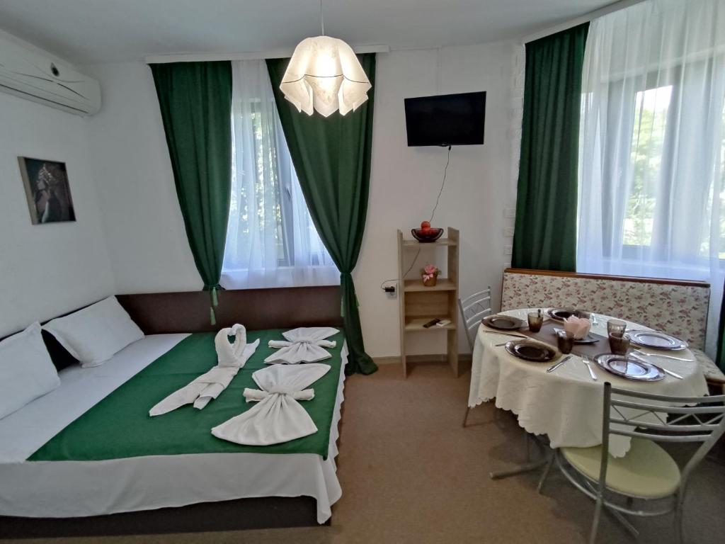 Postel nebo postele na pokoji v ubytování Rali Apartments