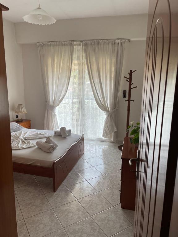 A bed or beds in a room at Panos Studios