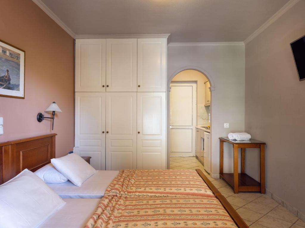 Postel nebo postele na pokoji v ubytování Villa Maria Laganas