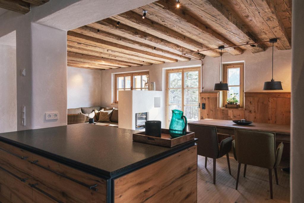 a kitchen with a large island in the middle of a room at Mountain Residence Bergrichter in Sankt Anton am Arlberg