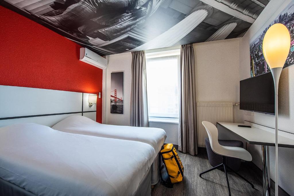 Postel nebo postele na pokoji v ubytování Ibis Styles Strasbourg Centre Gare
