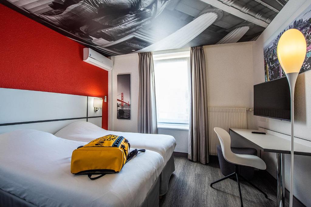 Postel nebo postele na pokoji v ubytování Ibis Styles Strasbourg Centre Gare