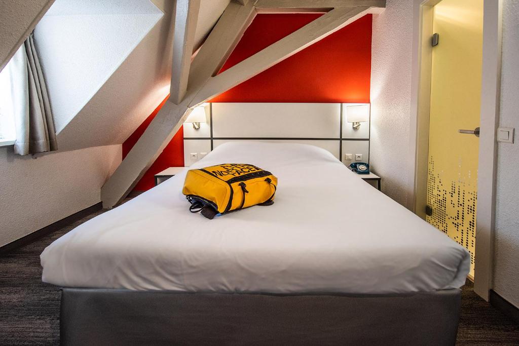 Postel nebo postele na pokoji v ubytování Ibis Styles Strasbourg Centre Gare