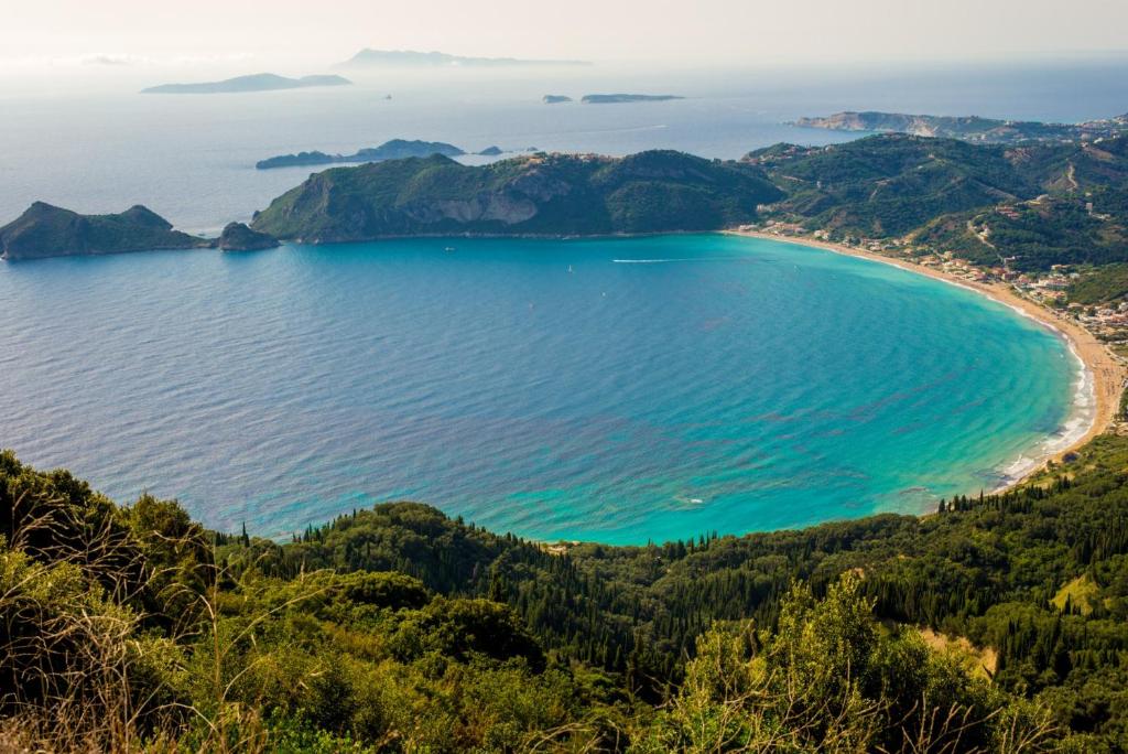 a view of a beach on the coast at Villa Lucia in Agios Georgios Pagon