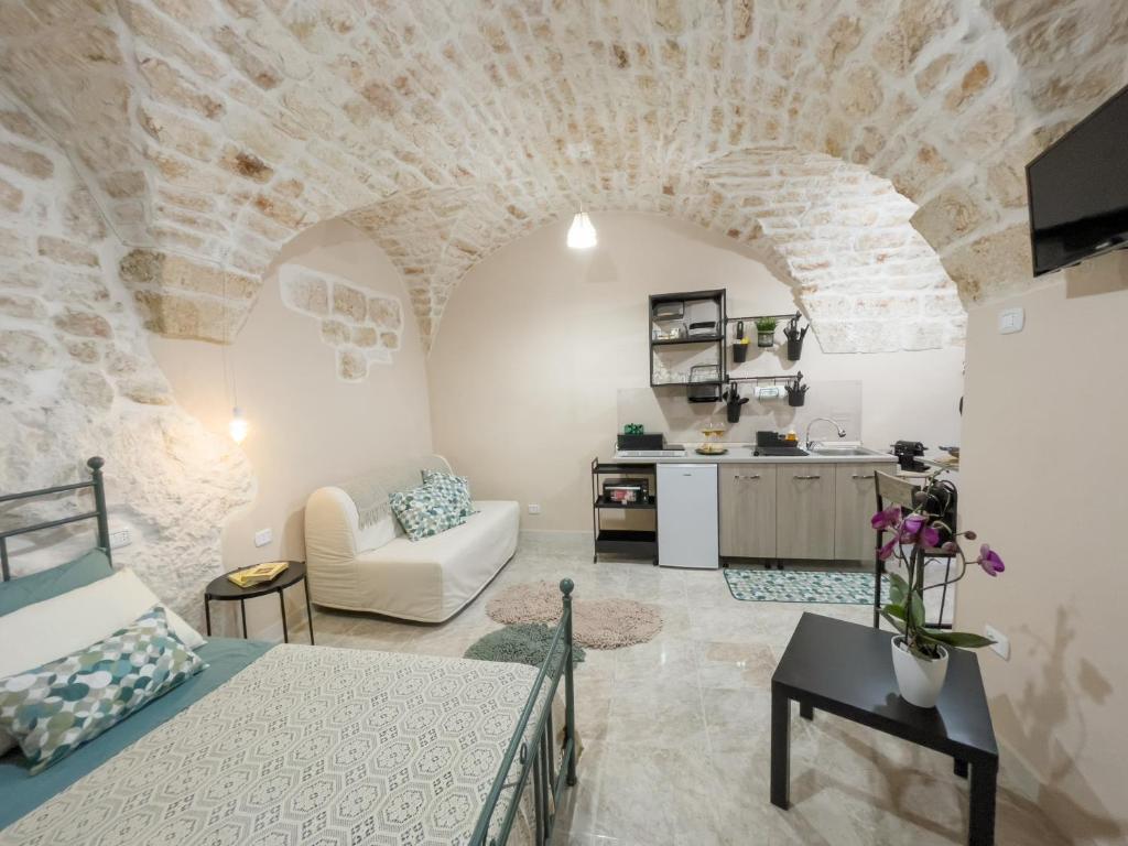 Televízia a/alebo spoločenská miestnosť v ubytovaní Petras, holiday home in Puglia...